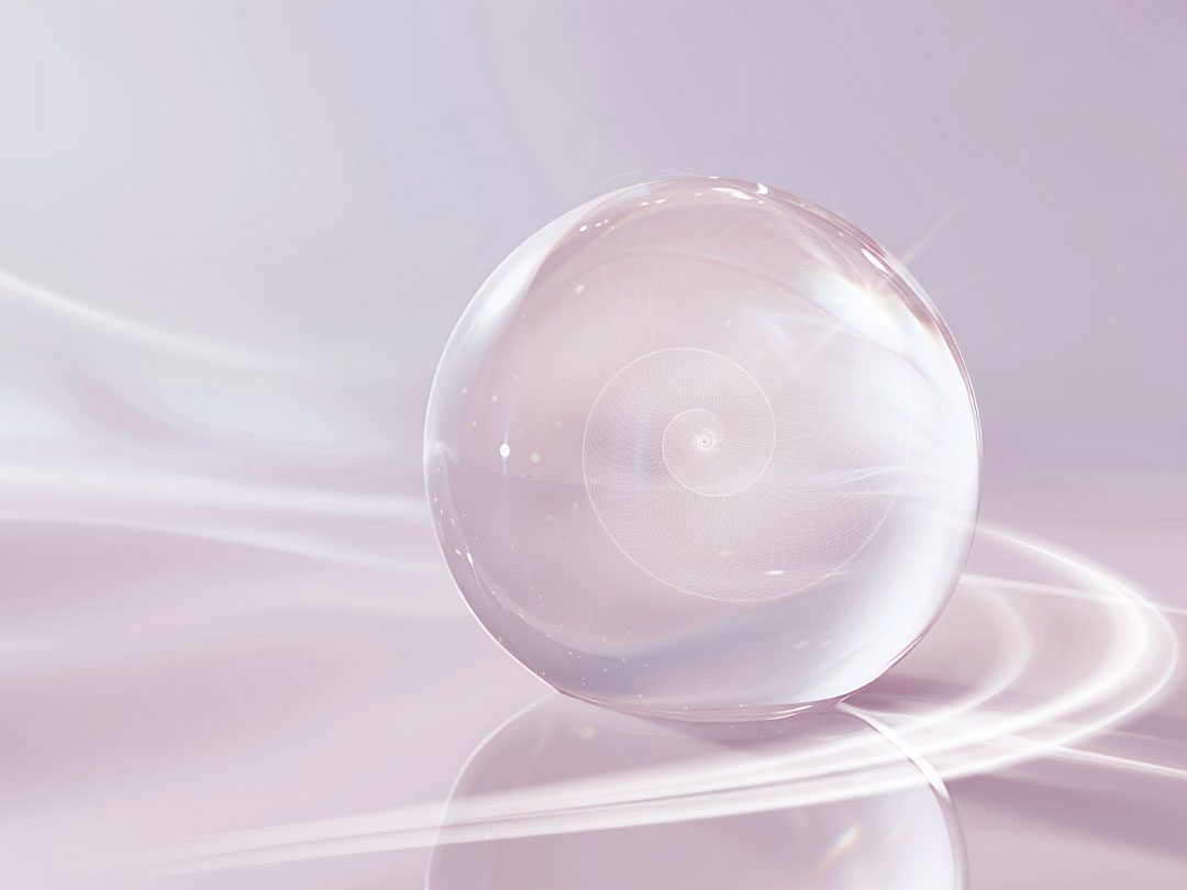 Translucent glass orb with an inner spiral pattern, resting on a flowing pink and lavender background for elisa shines professional hypnotherapy services.
